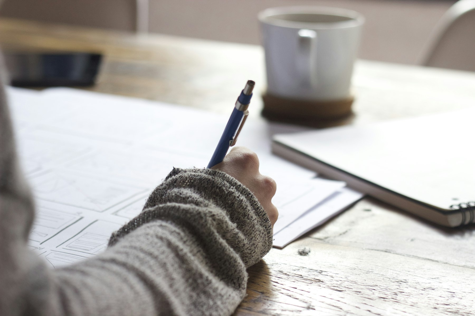 Writing notes by hand while studying