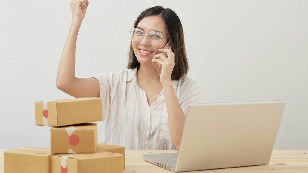 A woman sitting in front of a laptop computer