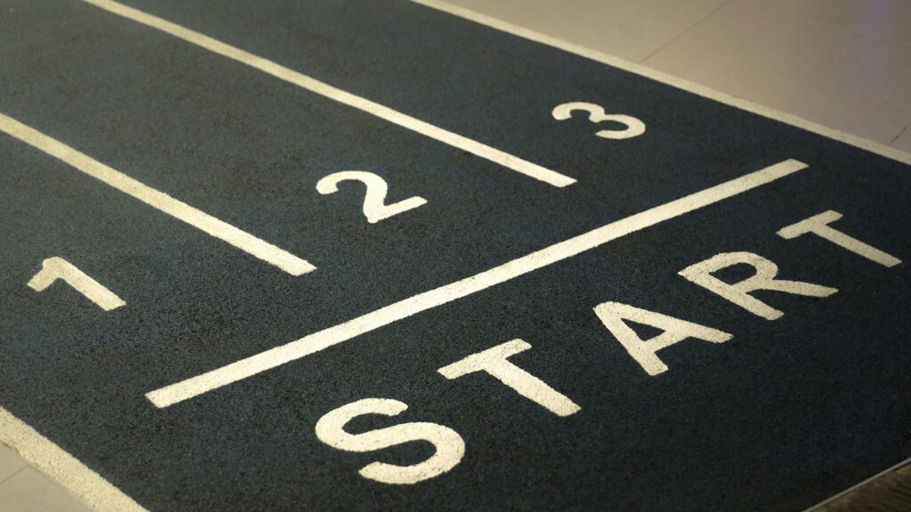 A close up of a street sign on the ground