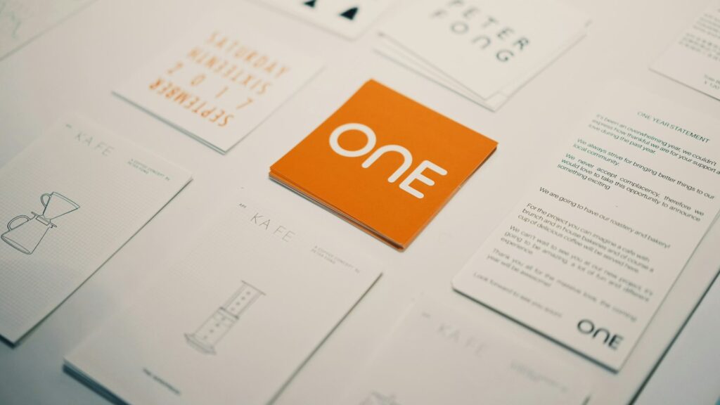 Orange card with "one" logo surrounded by other cards