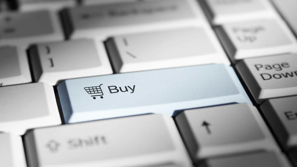 Close-up of a keyboard with a prominent 'buy' button