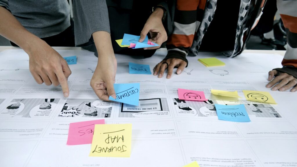 Team collaborating with sticky notes