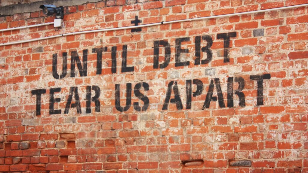 A brick wall with a message written on it