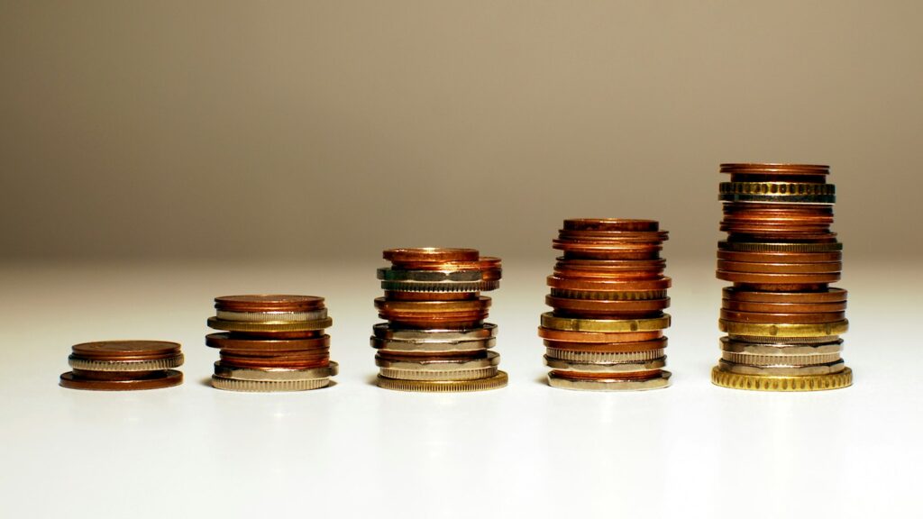 Stacks of coins increasing in height from left to right