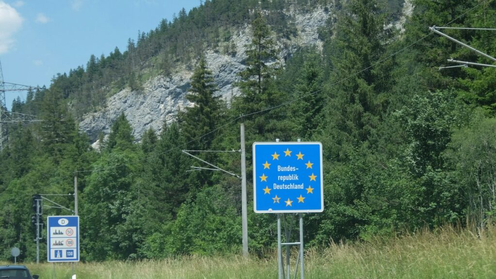 European union border sign beside a mountain road