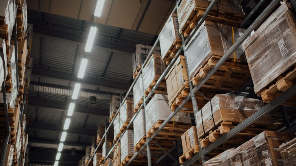 Brown cardboard boxes on white metal rack