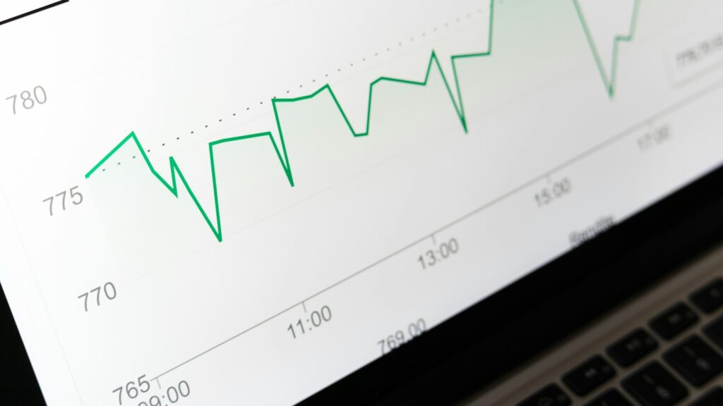 Stock market chart displayed on laptop screen