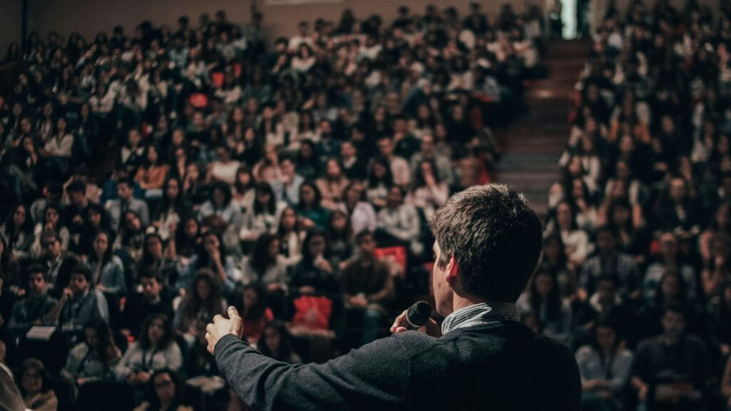 Man speaking in front of crowd
