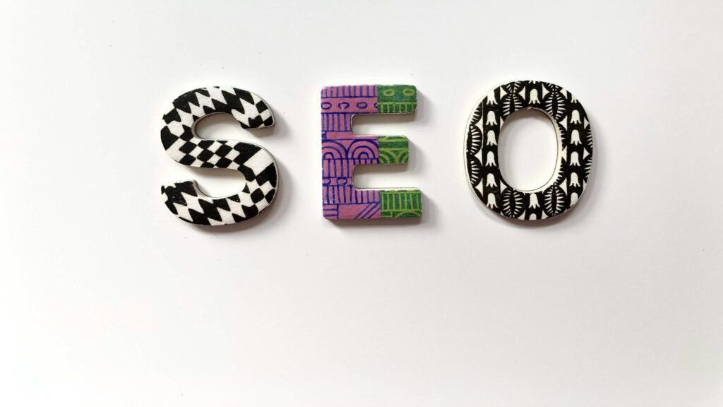 The letters S, E, and O with patterned surfaces on a white background