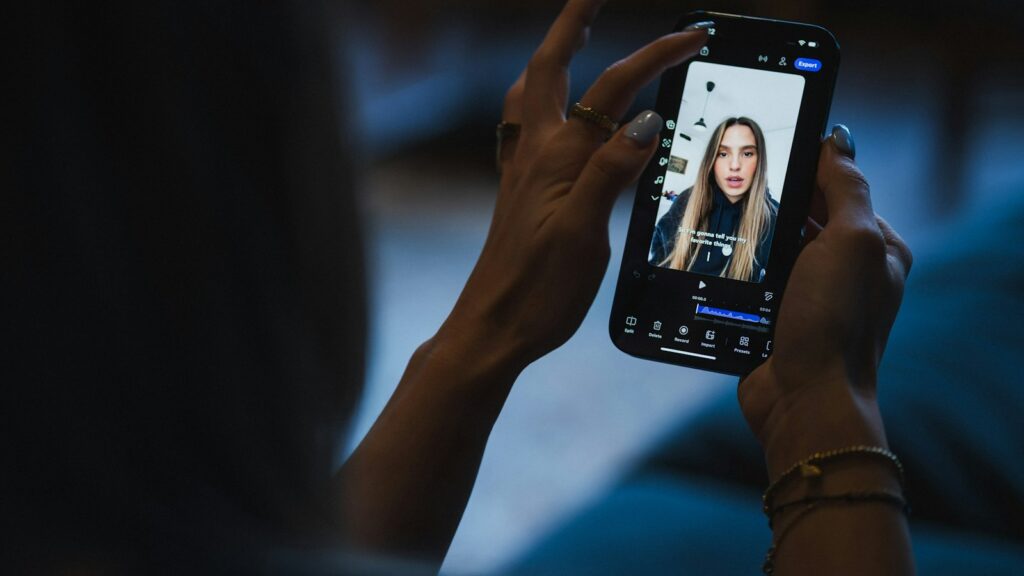 Person watching video on smartphone screen of smartphone