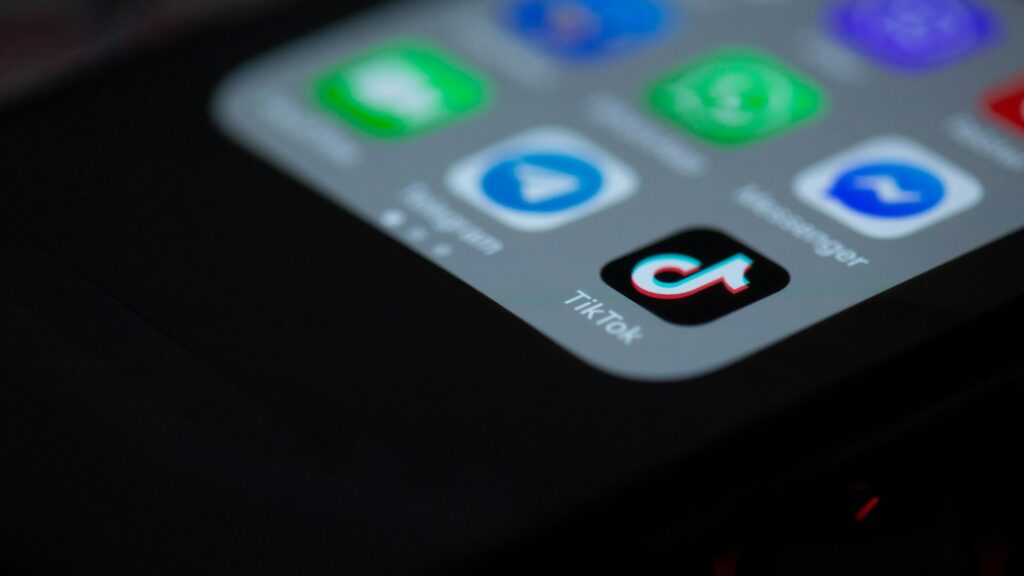 Black iphone 4 on black textile
