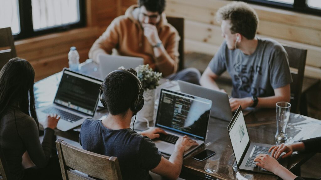 Group of people using laptop computer